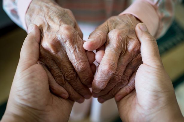 1_Young-woman-holding-elder-hands