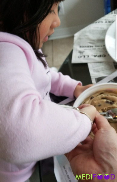 Izzie making cookie